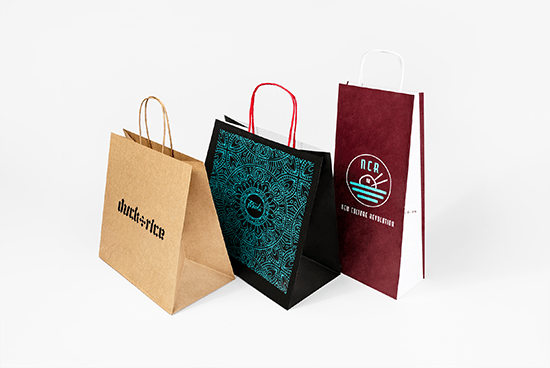 A selection of carrier bags in a range of sizes. Both with and without handles.